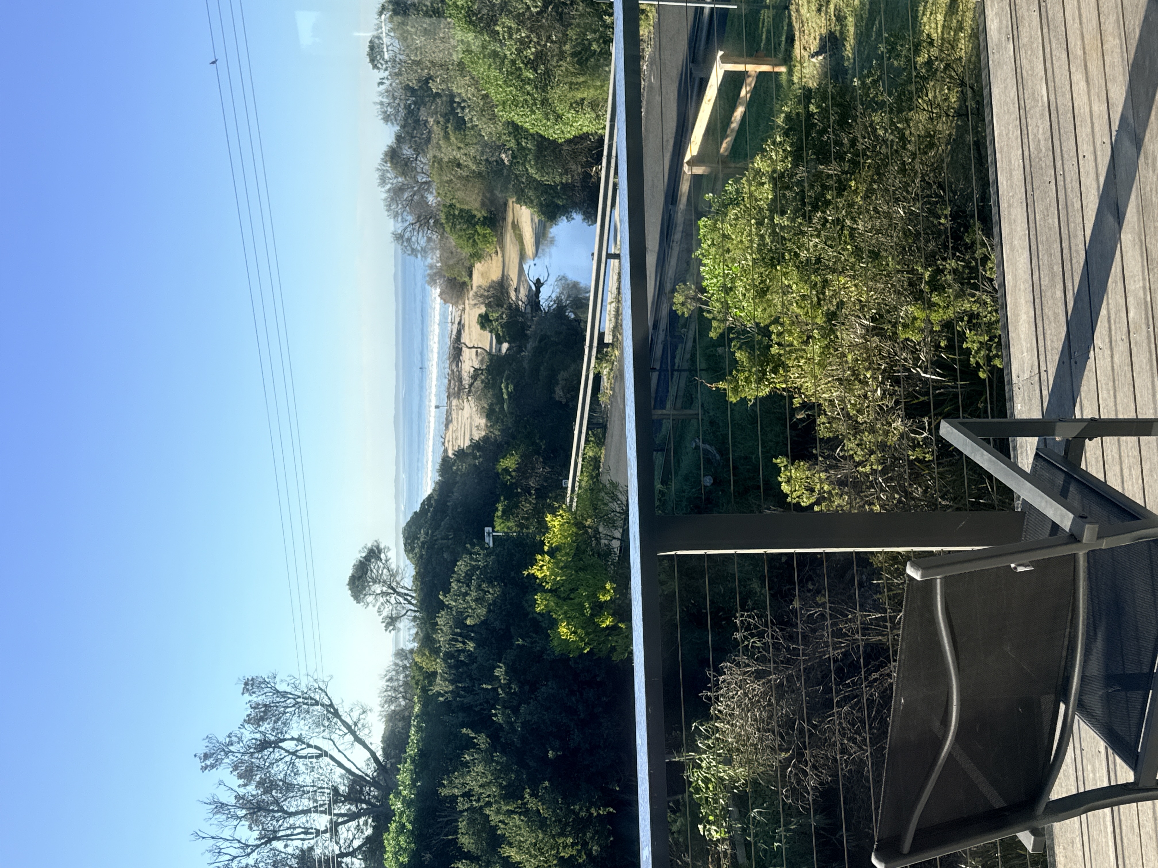 Balcony view over the bush to the ocean